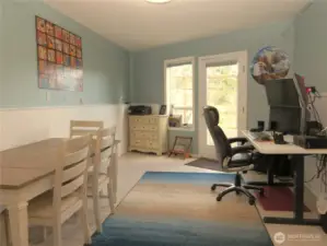 THE LOWER LEVEL ROOM IS BEING USED AS A HOME OFFICE, BUT IT HAS A GREAT VIEW OF THE PATIO GARDEN AND WATERFRONT!