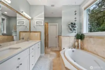 Deep soaking tub, full shower and dual sinks.  Walk-in closet in just beyond.