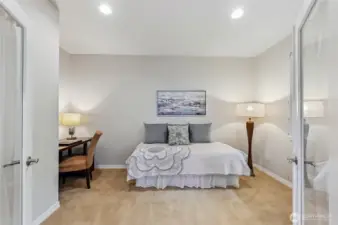 Off the great room is the den/guest room with glass French doors.