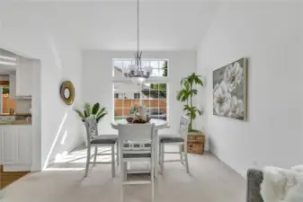 The dining room is perfectly positioned next to the kitchen, making mealtime effortless and gatherings seamless.