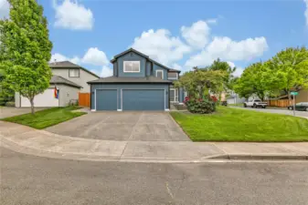 Plenty of parking with a spacious 3-car garage and an extra-wide driveway, offering convenience and ample space for multiple vehicles.