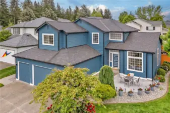 The beautifully crafted stamped concrete patio offers the perfect space to unwind in the afternoon while enjoying friendly gatherings with neighbors in a welcoming setting.