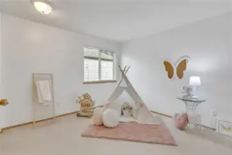 One of three upstairs bedrooms, this comfortable secondary bedroom offers versatility and charm, perfect for guests, family, or a personalized retreat.