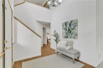 The impressive two-story entrance makes a striking first impression, welcoming you with timeless style and architectural distinction. The stylish LVP flooring enhances the entry, hallway, kitchen, and family room with a warm, modern aesthetic. Designed for durability and easy upkeep.