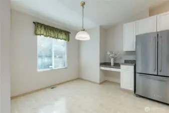 Breakfast nook includes a built-in desk. Refrigerator is only 1.5 years old!