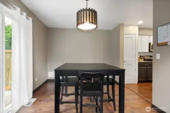The dining room is nice sized and to the left a slider leads to the fully fenced backyard and swing!