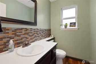 Lovely half bath. Full back splash tile is a plus!
