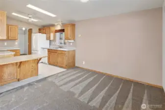 Spacious dining room looking into the kitchen