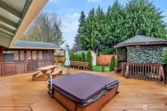 The screened in sunroom is the perfect place to stage buffets for summer picnics. The 9'x10' gazebo offers wonderful shade for outdoor entertaining and the hot tube is conveniently located just outside the Primary Suite.