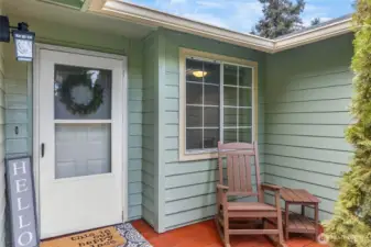 The welcoming covered front porch is perfect for morning coffee or greeting guests.