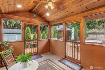 The versatile screened-in sunroom is conveniently located off the kitchen & family room with access to the expansive deck through 2 screen doors. It's the perfect place to stage a buffet for parties or picnics!