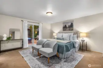 The spacious primary suite features dual closets, a slider to easy hot tub access & a stunning full tile walk-in shower in the private bath.