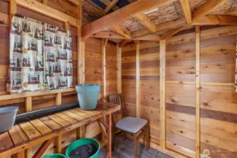 Gardeners will love this adorable potting shed with workbench & loft for storage!
