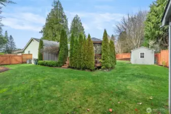 Double gate access from the front yard opens to wonderful green lawn or gardening space in the back.
