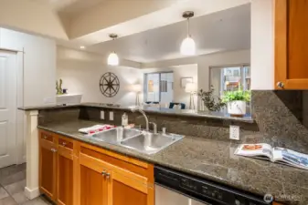 This open layout with the low breakfast bar in the kitchen is great for entertaining.