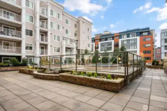The courtyard area complete with two soaking hot tubs and patio are amenities to enjoy.
