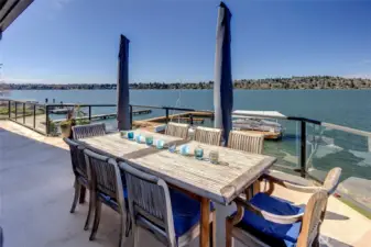 Expansive, unobstructed views stretch across more than 180 degrees from the deck, creating a truly immersive waterfront experience. Pictures can not capture how vast this view is.  This vantage is the perspective looking south.
