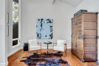 A charming alcove offers the perfect setting for a grand piano or a quiet nook to read and take in the scenery.