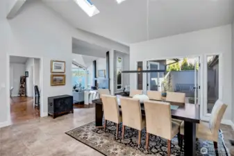 Just beyond, a peaceful courtyard with a fountain provides a private outdoor retreat, ideal for al fresco dining, container gardening, or simply enjoying a cool, shaded escape on warm summer days.