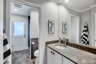 With direct access from the lower level patio, this bath offers the perfect spot for an easy rinse after time in the lake or a soak in the hot tub.