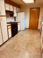 The kitchen offers a lot of cabinets and counter space! New tops, sink flooring and maybe appliances to make it updated! All useable until you do the work.