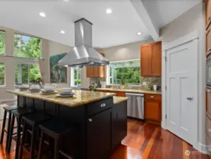 The spacious kitchen also includes a large pantry with built-in shelving & automatic lighting.