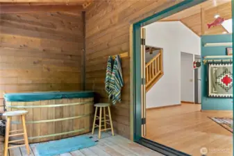 Screened sleeping porch with hot tub for soaking and relaxing.