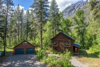 Detached 2-car garage with workshop, kitchenette, and upper studio.
