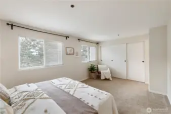 The primary bedroom has plenty of natural light and a large closet.
