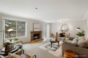 The large living room and dining area flow together to create a comfortable and easy living space, complete with wood burning fireplace and access to your 2nd floor deck.