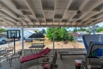 Covered patio in backyard.