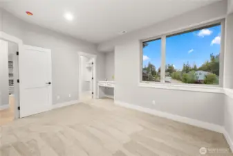 4th bedroom with walk-in closet and built-in cabinets