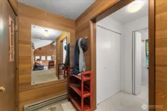 Front entrance to the condo overlooking a storage area, with access to the bathroom