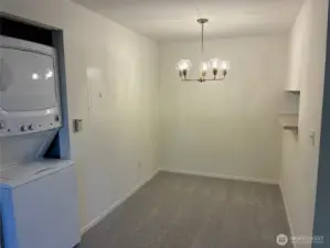 Full size stack washer and dryer is just off the dining room.