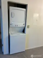 Full size stack washer and dryer stays with the unit.