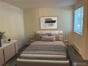 Spacious bedroom with open alcove /closet space. Virtually staged.