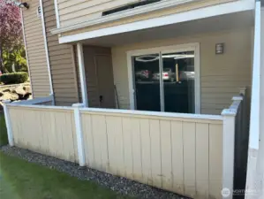 Fenced patio with storage