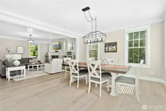 An expansive dining area made for relaxed coastal living - perfect for sharing meals and memories with friends and family. The table expands further to accommodate an even larger group. (Home sold fully-furnished!)