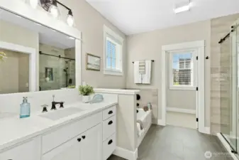 The primary en suite showcases gentle colors that bring a sense of calm - perfect for easing into or out of your day.