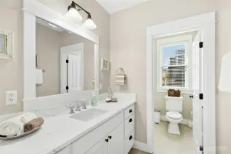 Bright and breezy second-floor bath with a shower/tub combo (out of view) - perfect after a day at the beach.