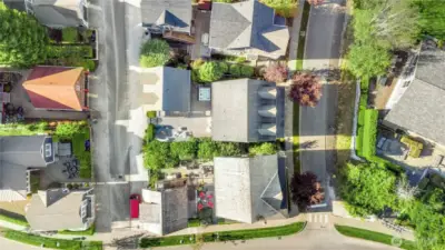 From this overhead view, you'll see the garage and back patio tucked along the alley, giving you the bonus of two separate entrances - one just for you, and the formal front entrance ready to welcome your guests.