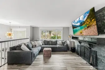 The entire home has new ceramic tile flooring for beauty and durability. This extra large stacked stone fireplace is wood burning - nothing better than the sound of crackling wood and comforting warmth on a cold night.