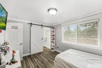 Primary bathroom with barn door.