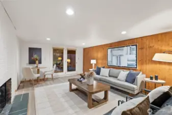 Lower level living space with water views and double doors to patio under the deck