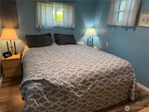 Primary bedroom. Yes, that is a king size bed fitting comfortably with night tables on both sides, comes with the home.