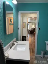 From the bathroom down the hall to the living room.