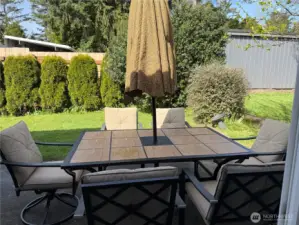 Table and chairs come with the home.