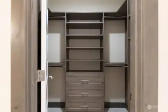 Primary bedroom closet with nice built-ins