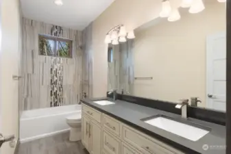 Full bathroom with double sinks