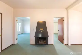 Electric Fireplace and Bedroom entrances.